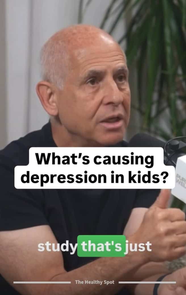 A man with short gray hair speaks into a microphone during an interview. Text on image reads: "What’s causing depression in kids? study that's just".